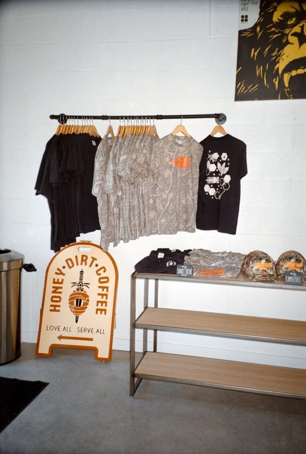 Honey Dirt merch rack and sandwich board