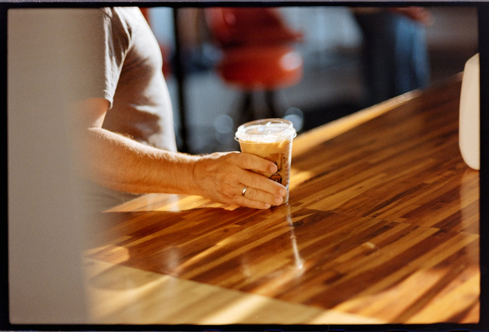 Honey Dirt iced coffee set on the wood counter