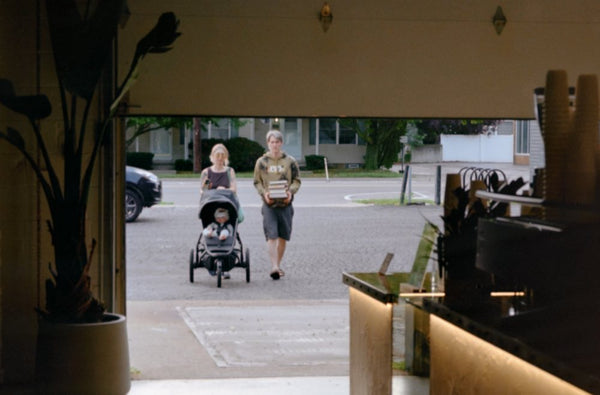 Neighbors walking up to the shop